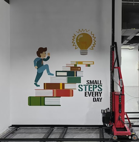 School mural of a child climbing books beneath a lightbulb